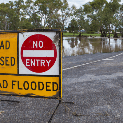 Road flooded sign on road in front of the flooded Condamine River in South East Queensland.